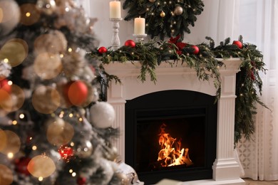 Photo of Room with fireplace decorated for Christmas holidays. Interior design