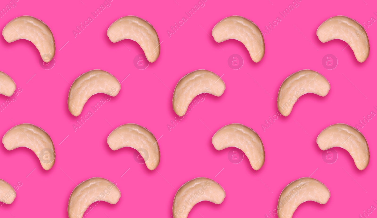 Image of Many tasty cashew nuts on pink background, flat lay. Banner design