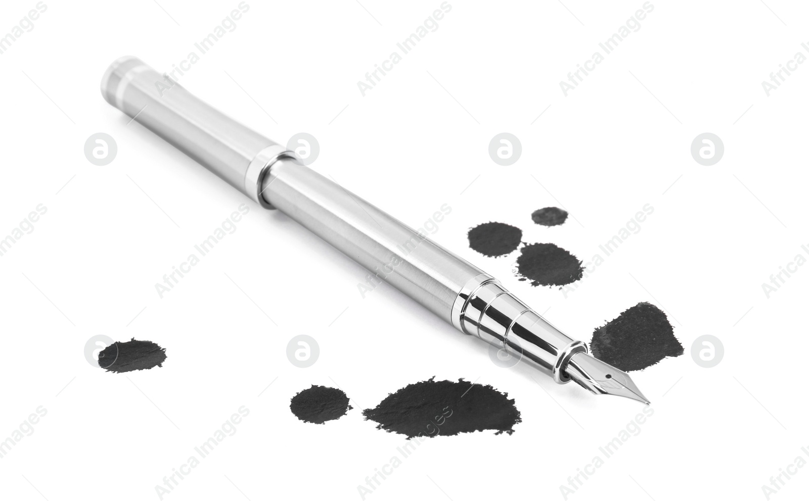 Photo of Stylish silver fountain pen and blots of ink isolated on white