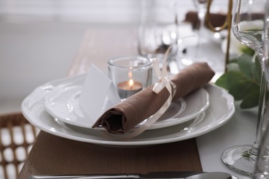 Photo of Festive table setting with beautiful tableware and decor, closeup