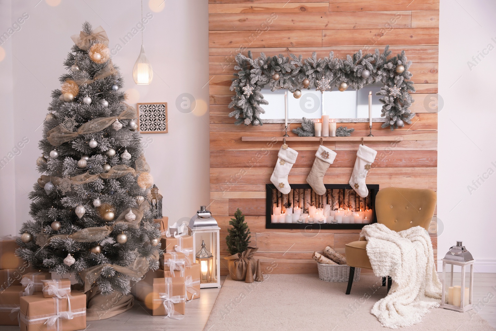 Photo of Festive interior with decorated Christmas tree and fireplace