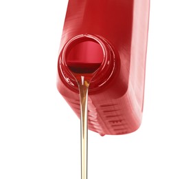 Pouring motor oil from red container isolated on white