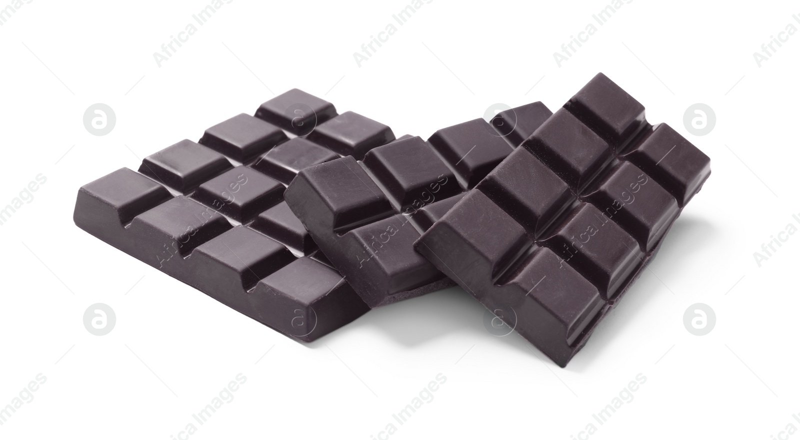 Photo of Pieces of delicious dark chocolate isolated on white