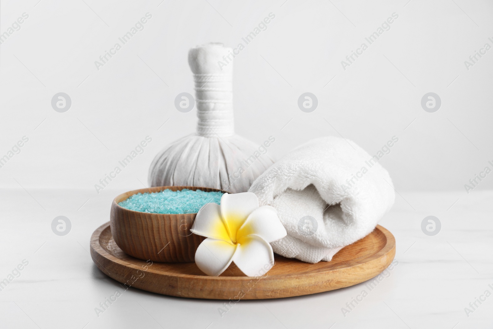 Photo of Spa composition with care products on white marble table