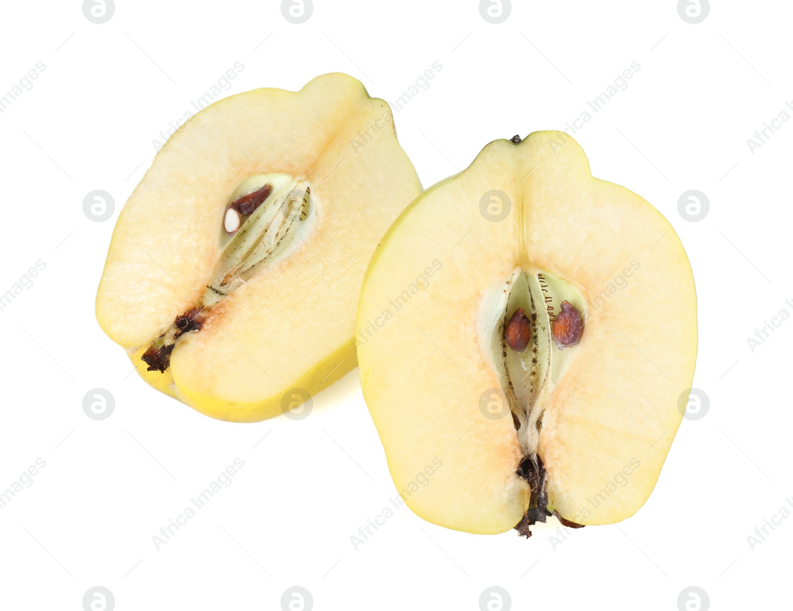 Photo of Halves of fresh ripe quince isolated on white