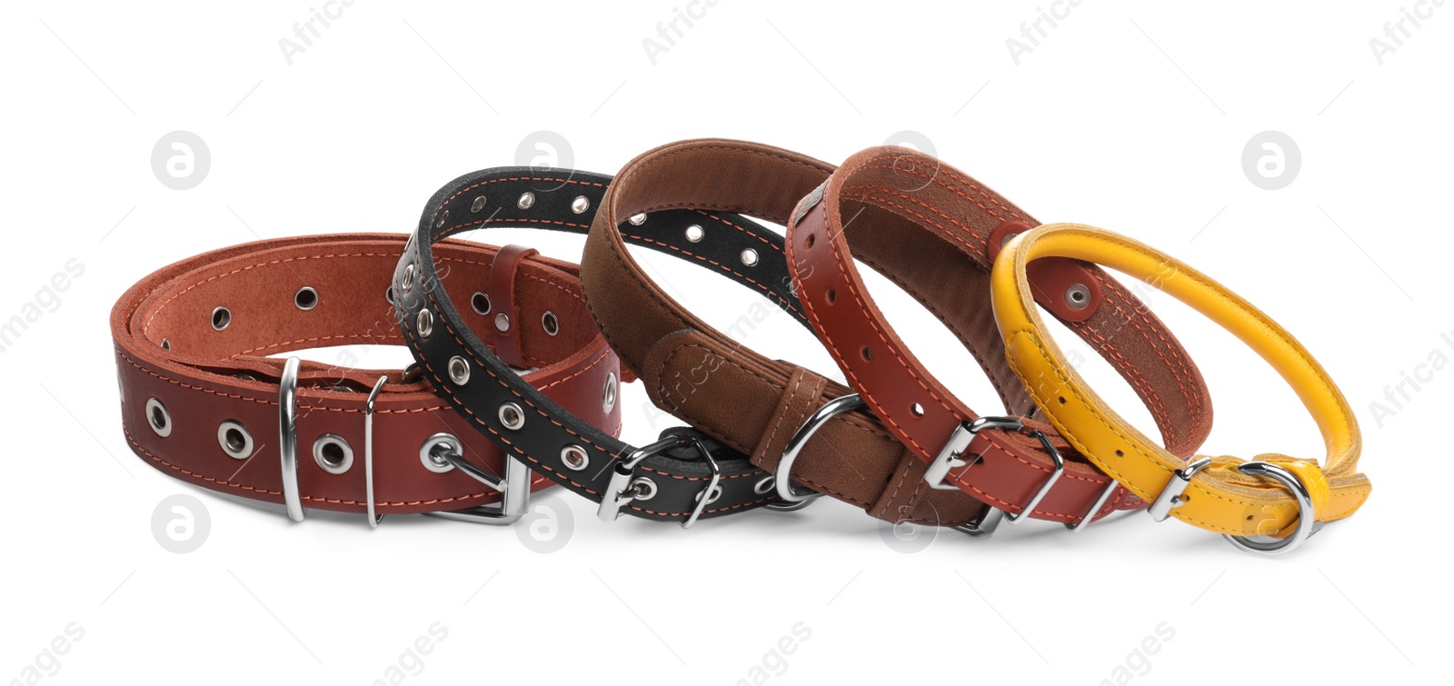 Photo of Different leather dog collars on white background