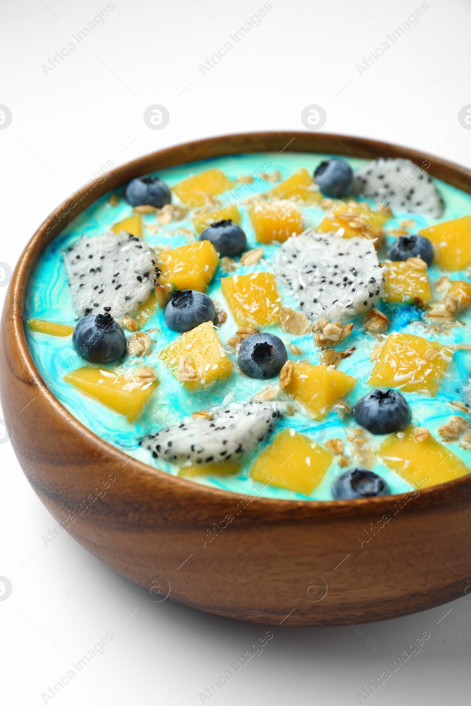 Photo of Delicious smoothie bowl with fresh fruits, blueberries and oatmeal on white background, closeup