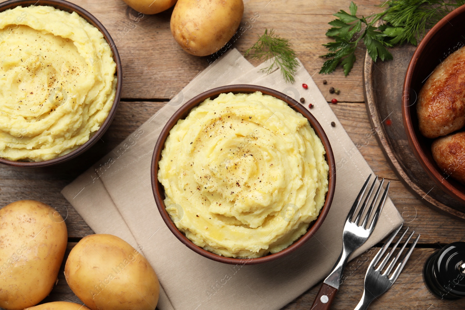 Photo of Flat lay composition with tasty mashed potatoes on wooden table