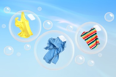 Image of Washing powder bubbles with clothes against cloudy sky