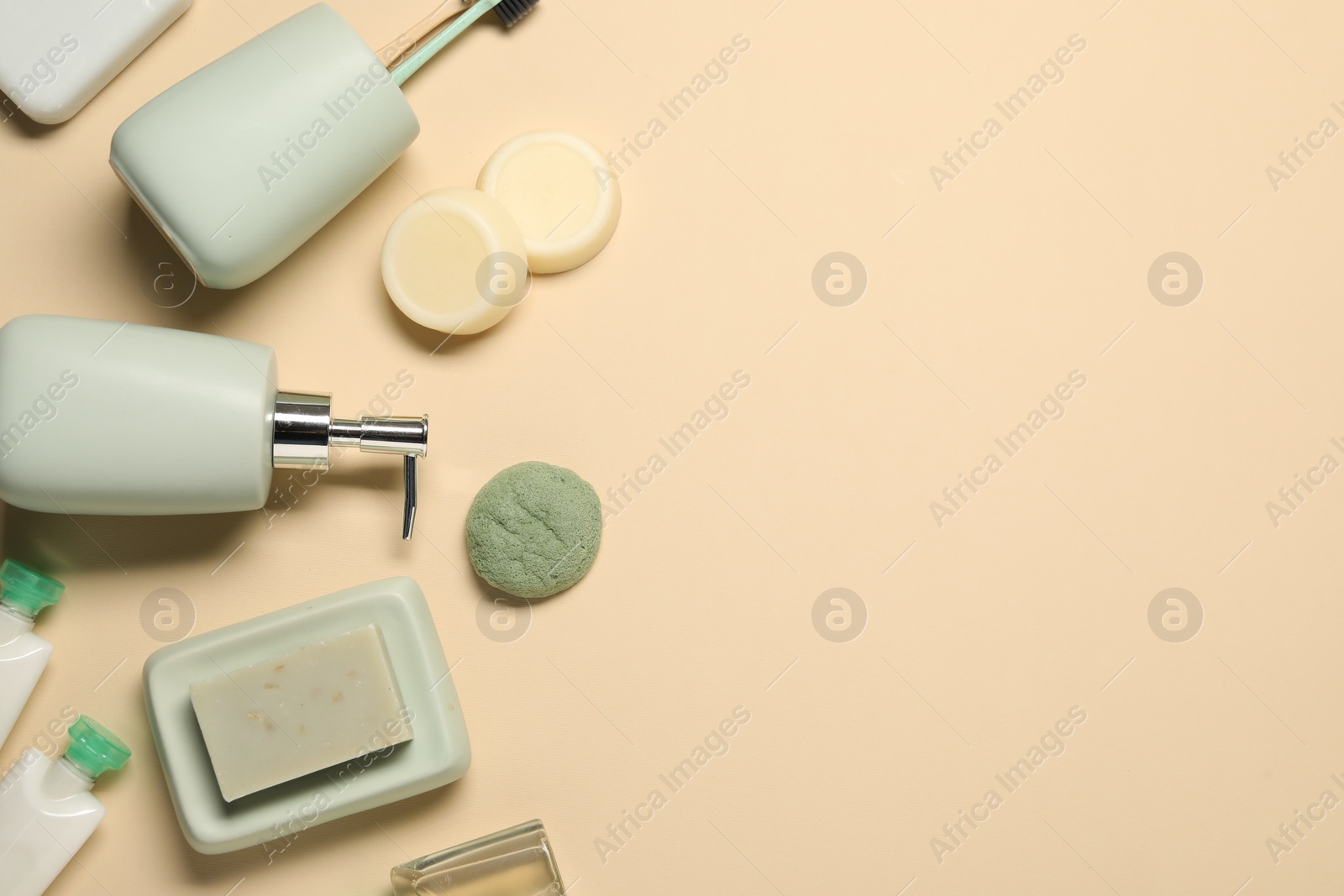 Photo of Bath accessories. Flat lay composition with personal care products on beige background, space for text