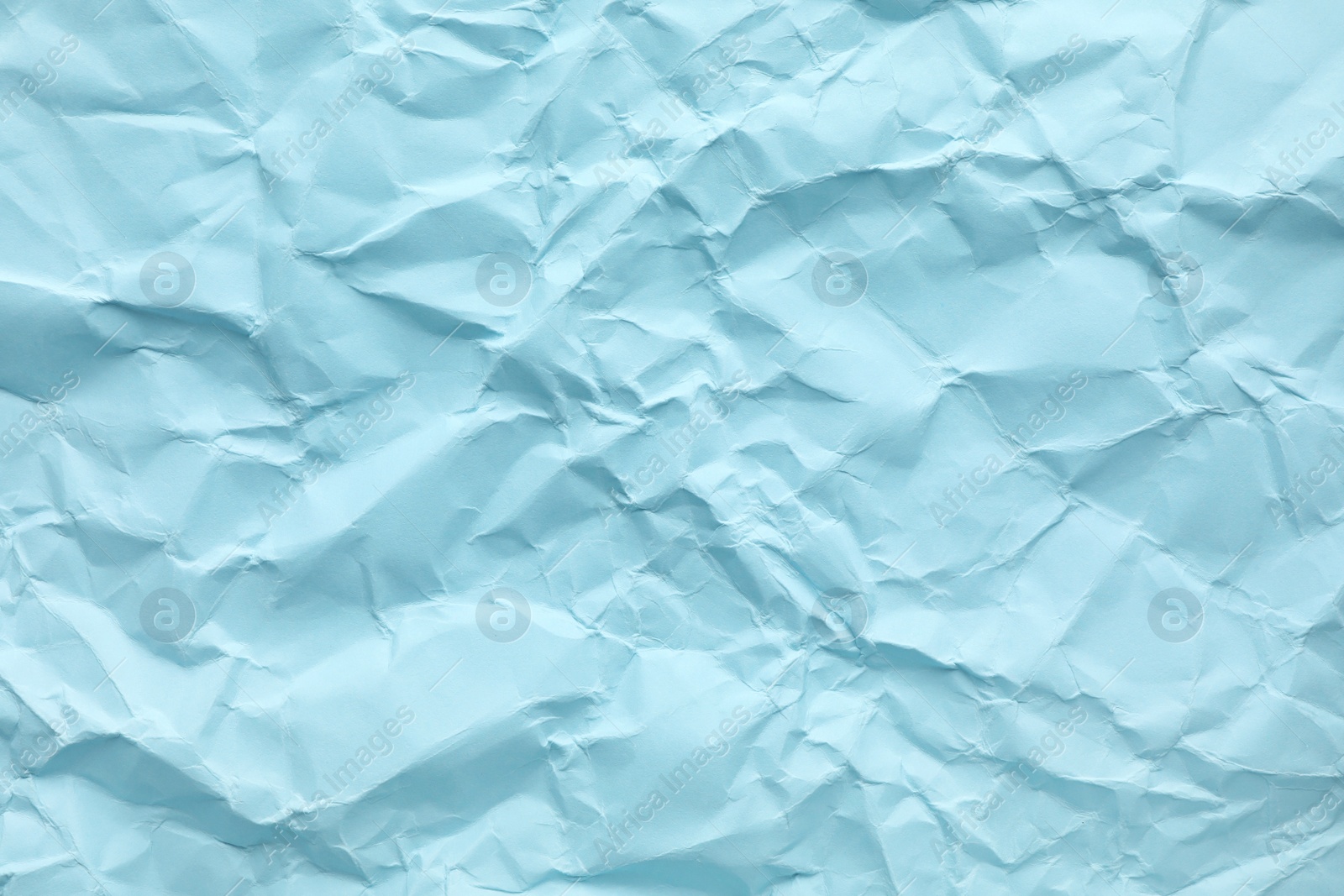 Photo of Sheet of color crumpled paper as background. Space for design