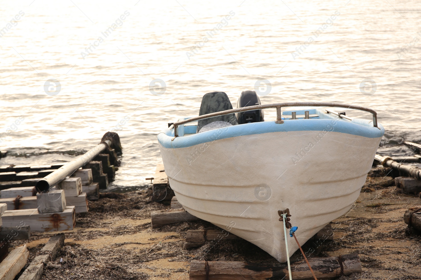 Photo of Moored boat on beach near sea outdoors