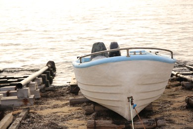 Photo of Moored boat on beach near sea outdoors