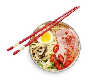 Photo of Delicious ramen in bowl and chopsticks isolated on white, top view. Noodle soup