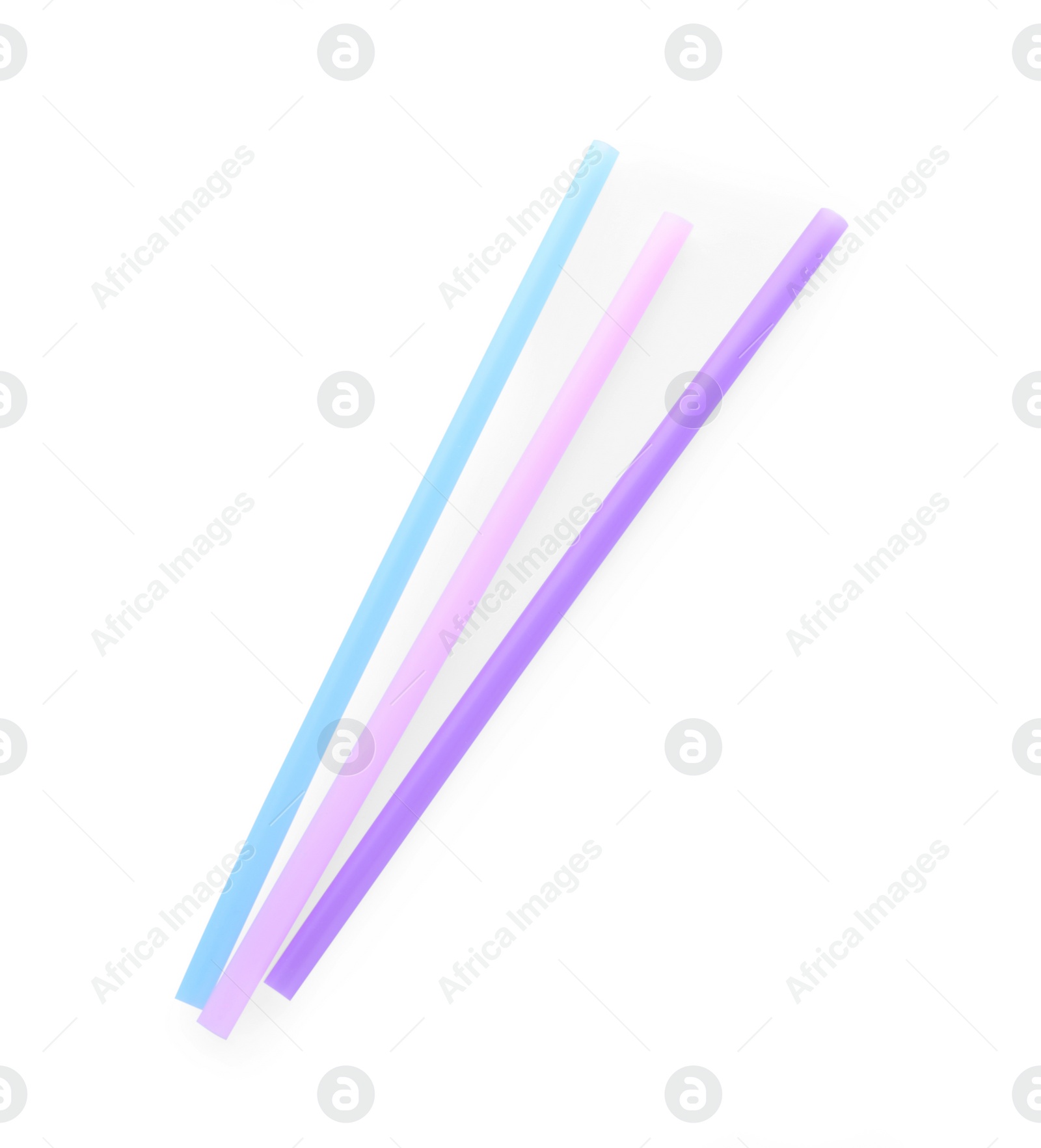 Photo of Color plastic cocktail tubes on white background, top view