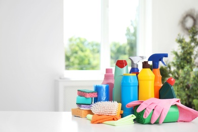 Set of cleaning supplies on table indoors