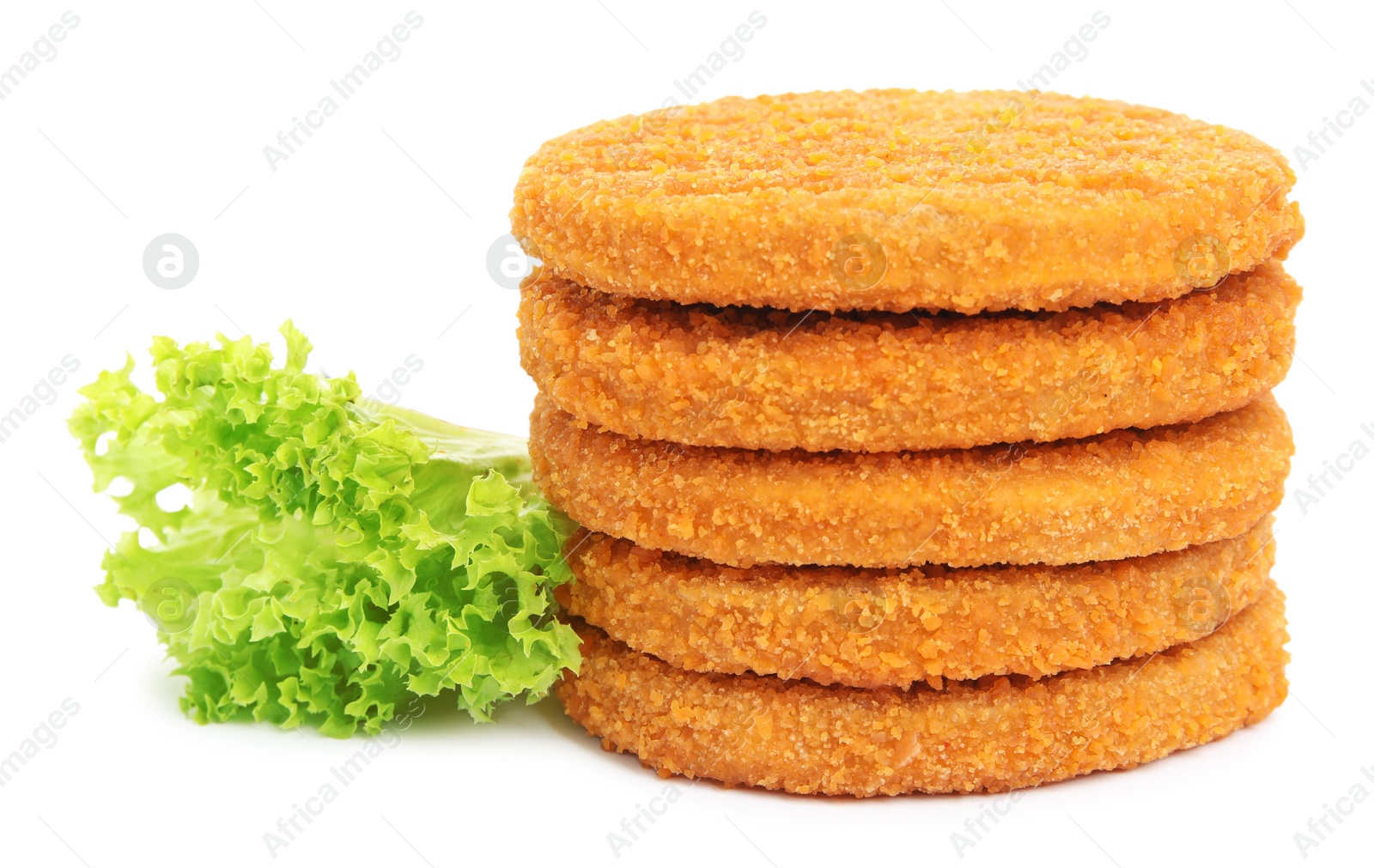 Photo of Uncooked breaded cutlets, tomato and lettuce on white background. Freshly frozen semi-finished product