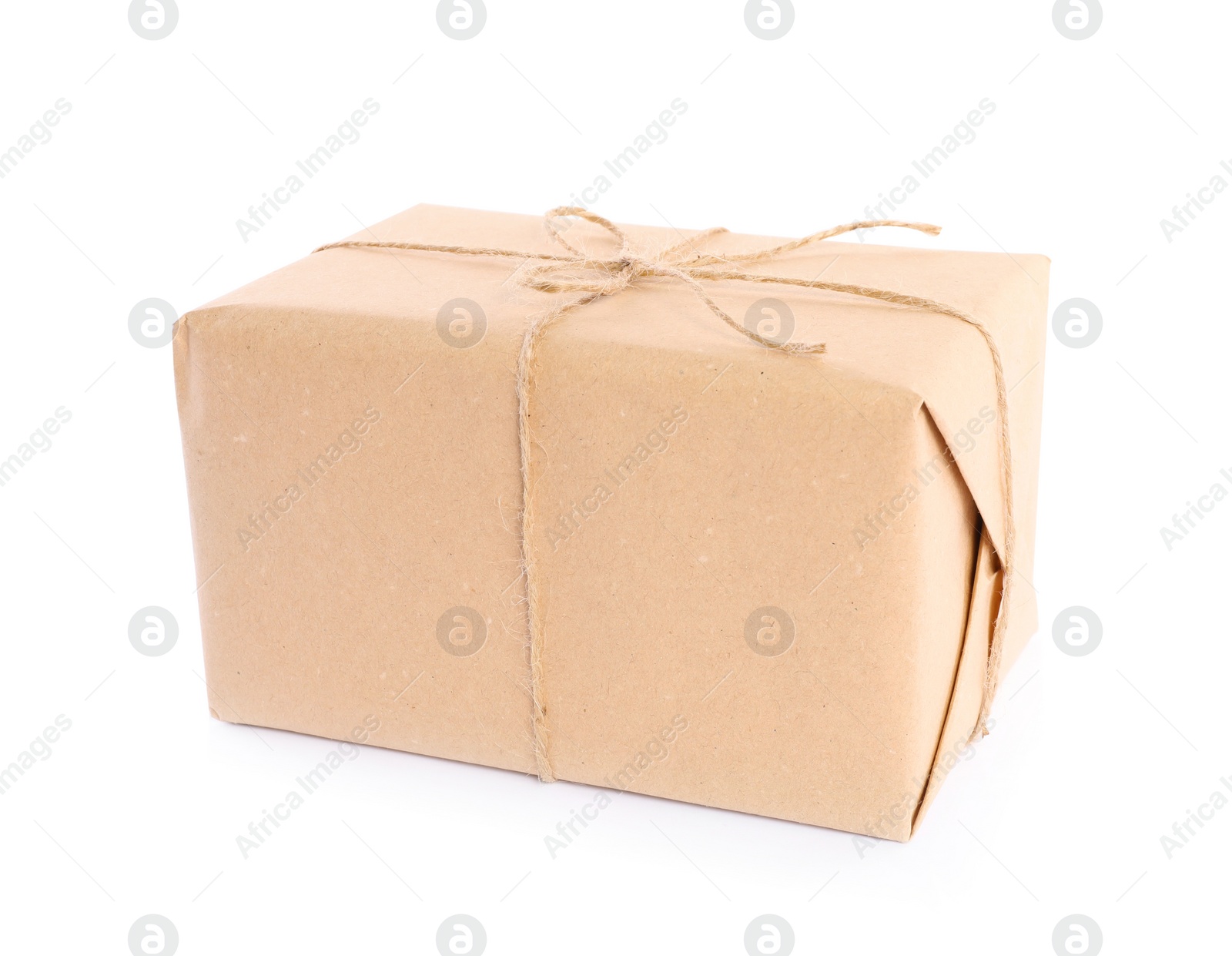 Photo of Parcel wrapped in kraft paper on white background