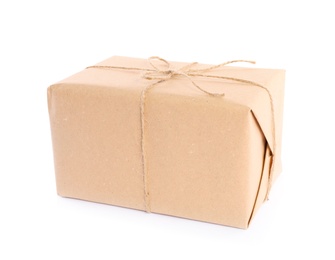 Photo of Parcel wrapped in kraft paper on white background