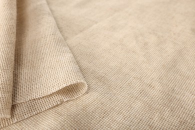 Texture of natural burlap fabric as background, closeup