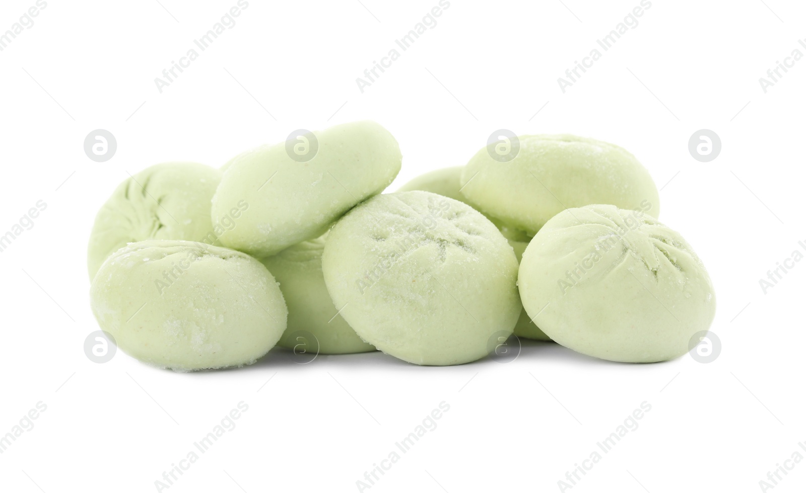 Photo of Heap of raw dumplings with tasty filling on white background