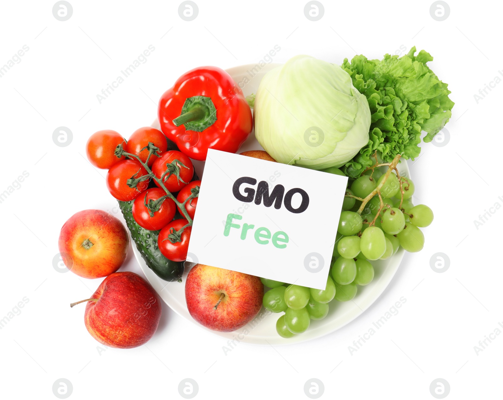 Photo of Fresh fruits, vegetables and card with text GMO Free on white background, top view