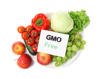 Fresh fruits, vegetables and card with text GMO Free on white background, top view