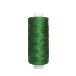 Photo of Spool of green sewing thread isolated on white