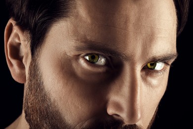 Image of Captivating gaze. Man with green eyes, closeup