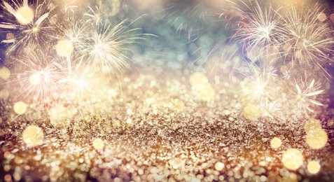 Abstract festive background with fireworks, bokeh effect. New Year celebration