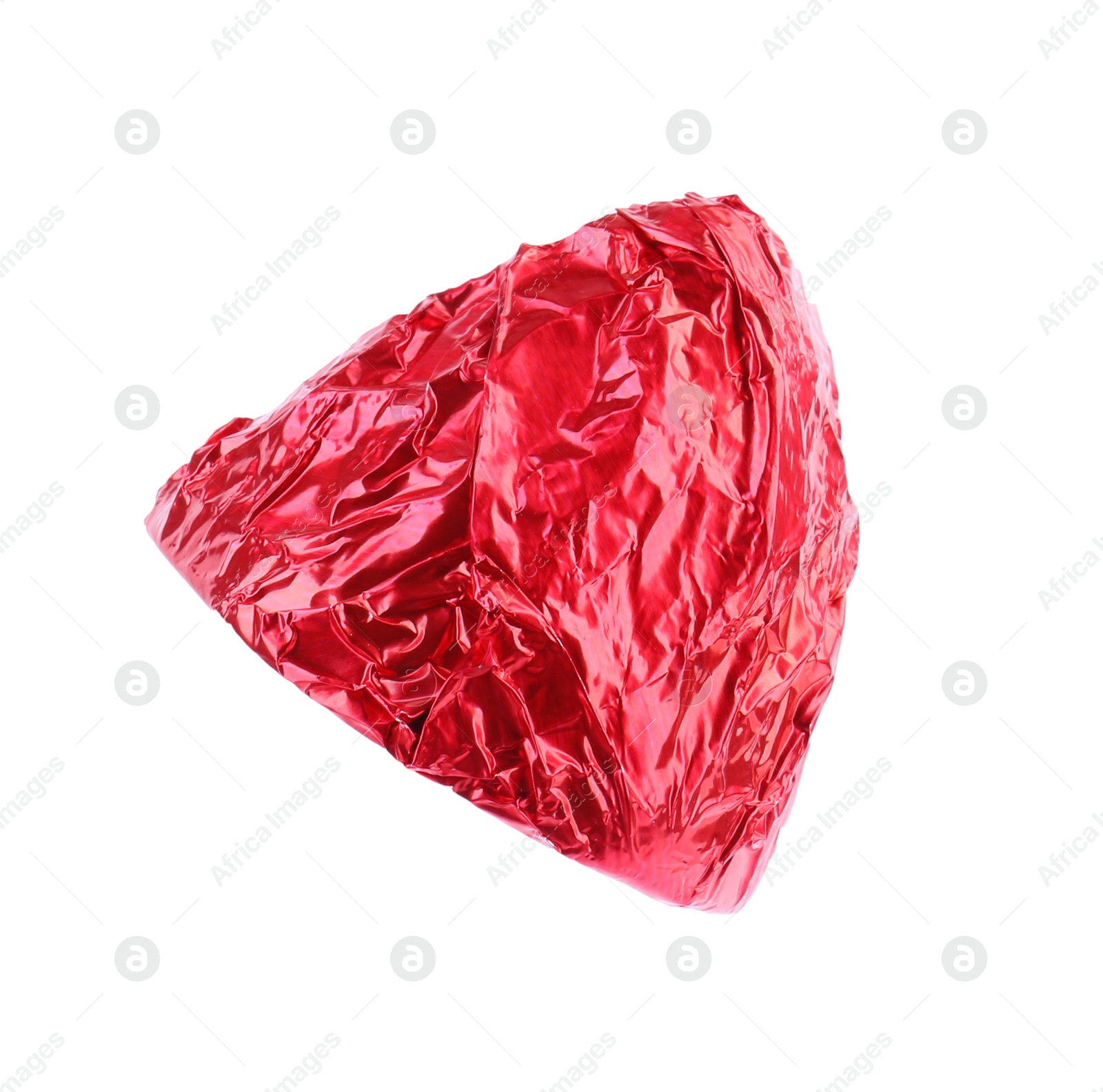 Photo of Tasty candy in red wrapper isolated on white