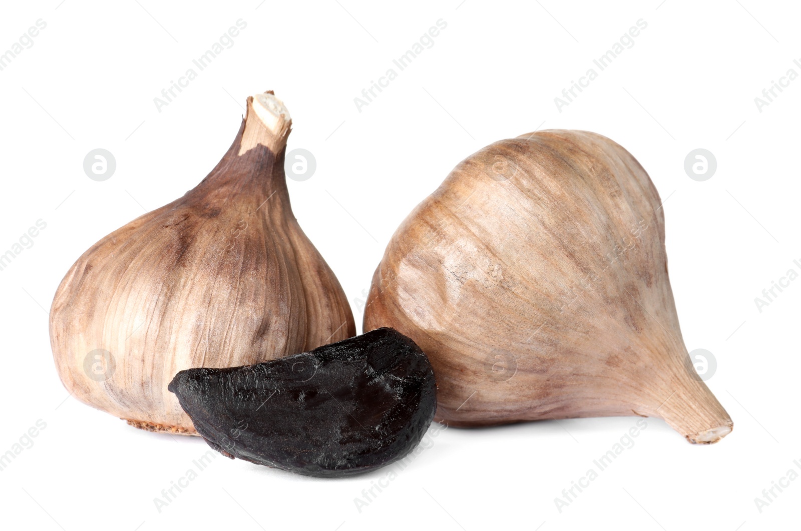 Photo of Aged black garlic on white background. Asian cuisine