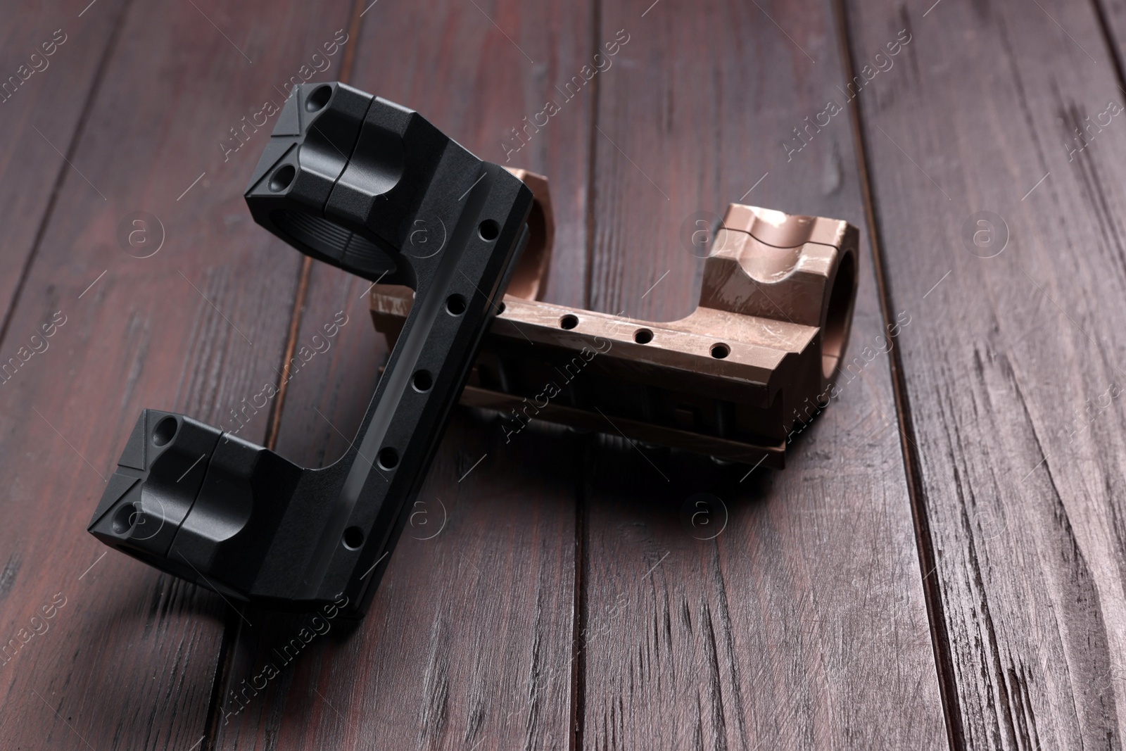 Photo of Quick disconnect sniper cantilever scope mounts on wooden table, closeup