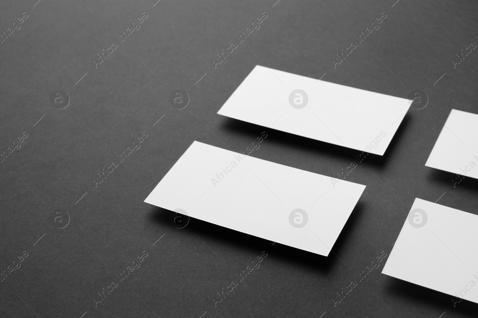 Photo of Blank business cards on black background. Mockup for design