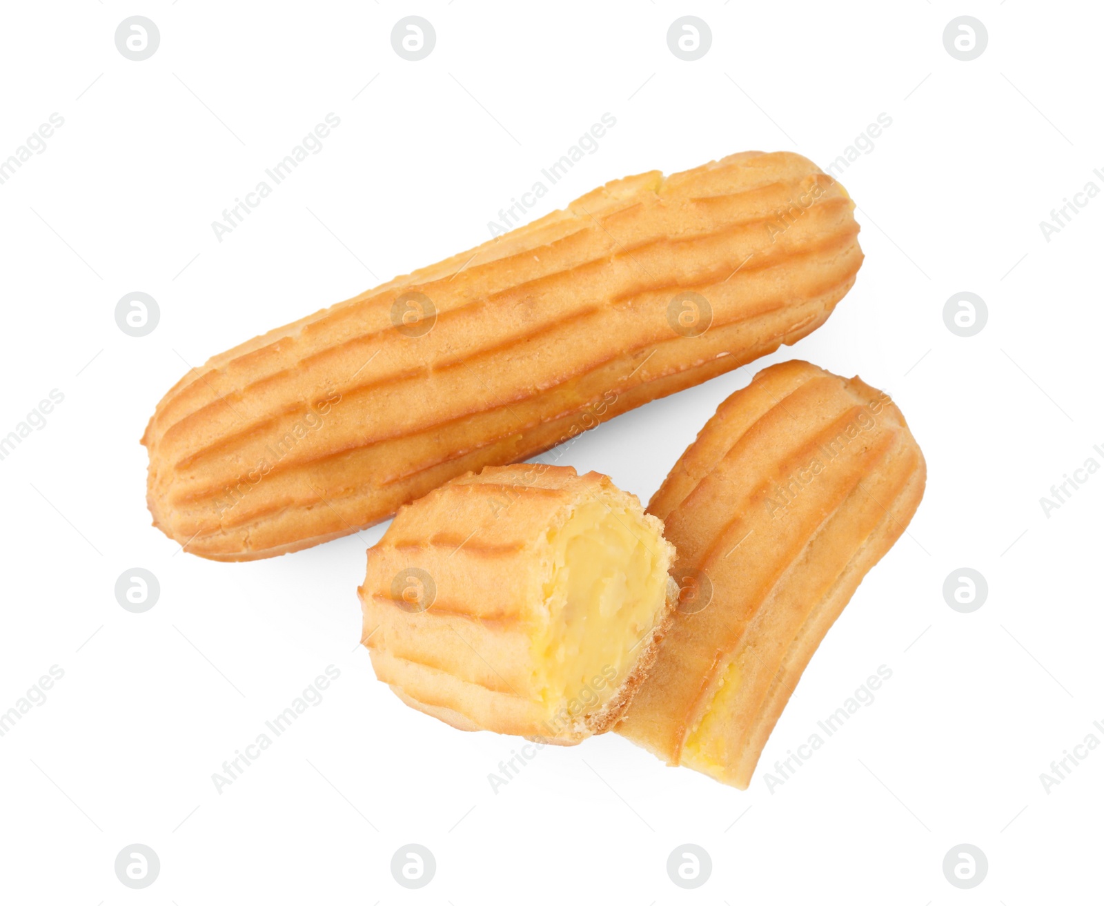 Photo of Delicious eclairs isolated on white, top view