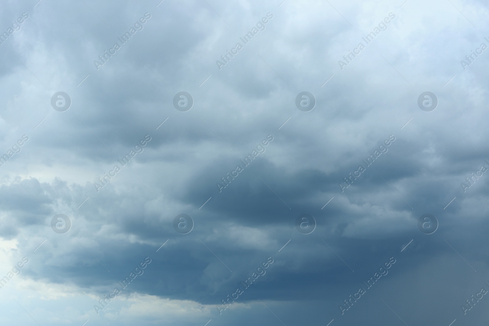 Photo of Sky with heavy rainy clouds on grey day