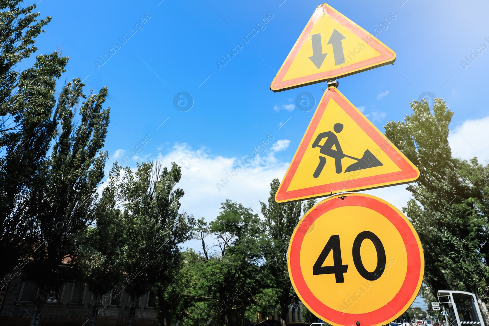 Photo of Traffic signs on city street, space for text. Road repair