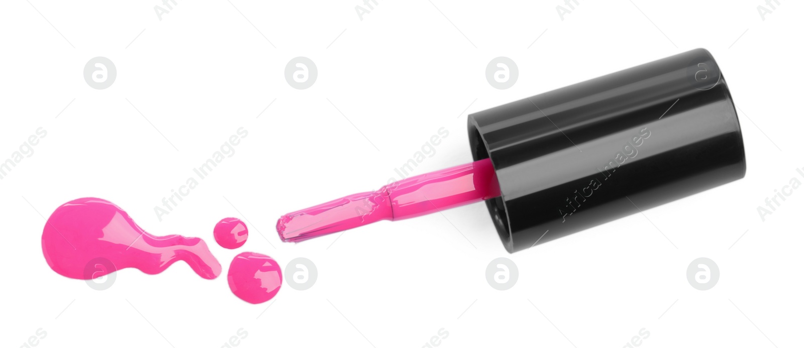 Photo of Brush and spilled pink nail polish isolated on white, top view