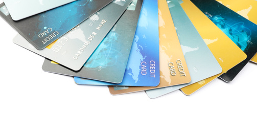 Photo of Different credit cards on white background, closeup