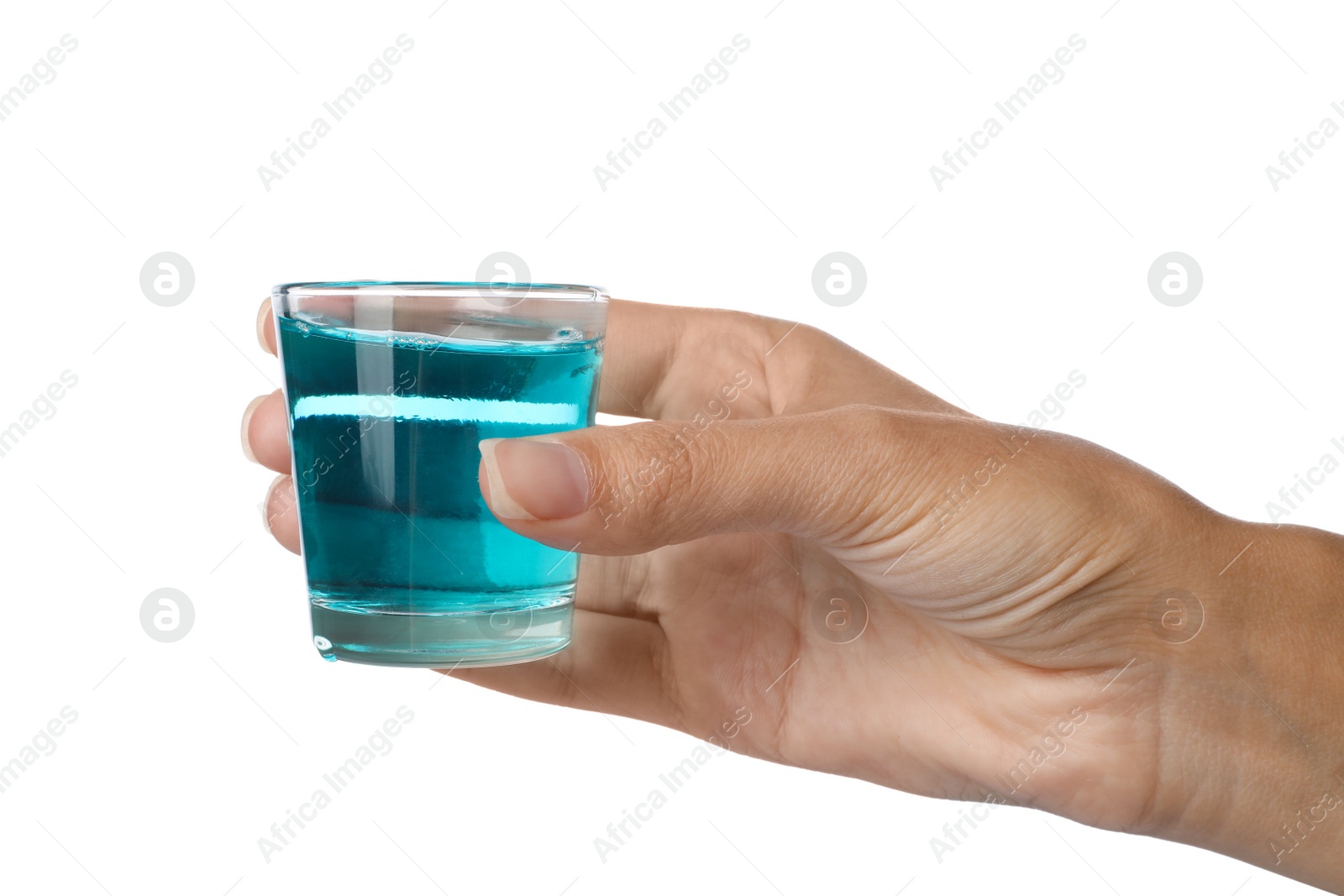 Photo of Woman holding glass with mouthwash for teeth care on white background