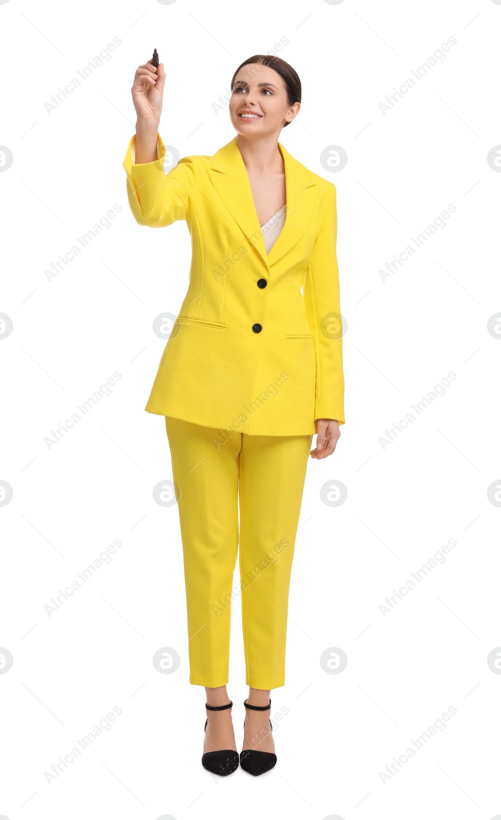 Photo of Beautiful businesswoman in yellow suit with marker on white background