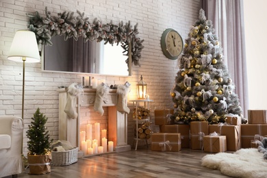 Stylish interior of living room with decorated Christmas tree