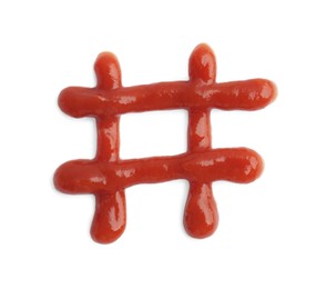 Hashtag symbol drawn by ketchup on white background