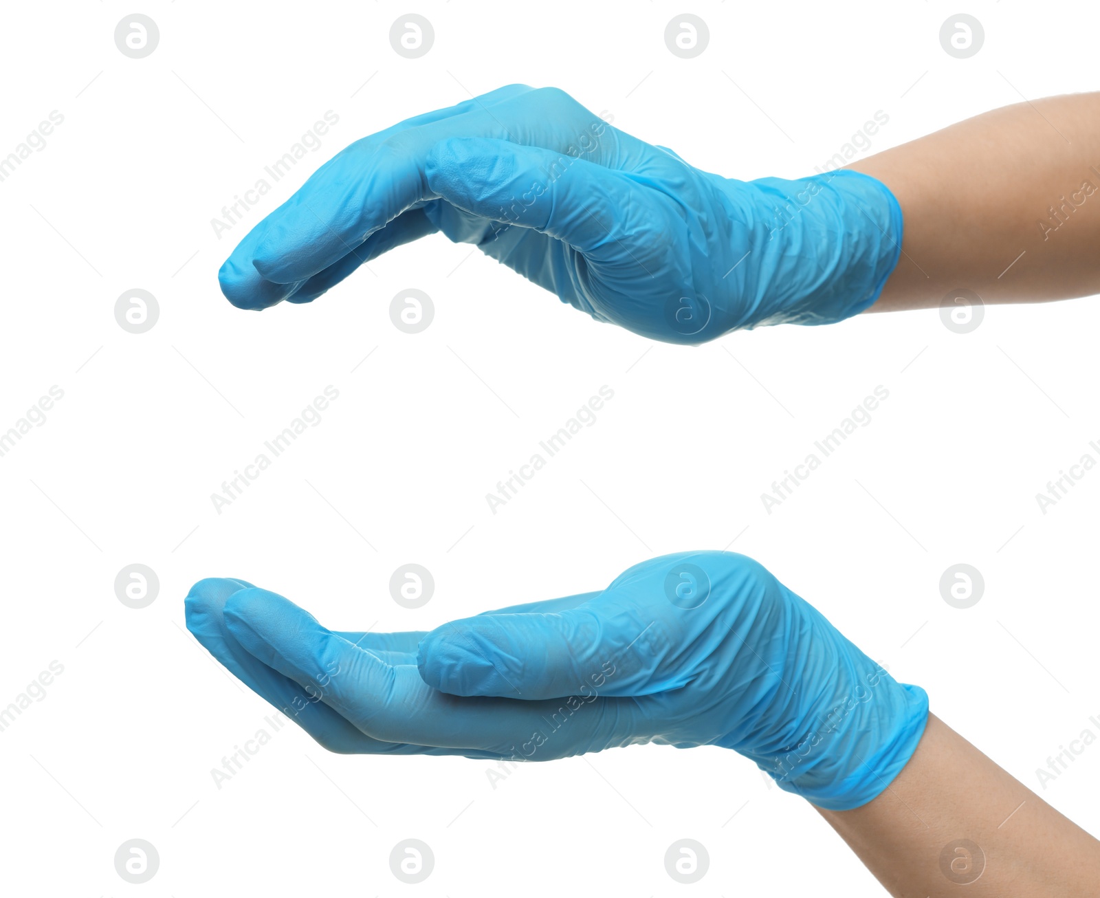 Photo of Doctor wearing light blue medical gloves holding something on white background, closeup