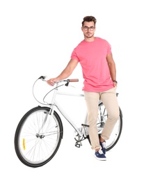 Handsome young hipster man with bicycle on white background