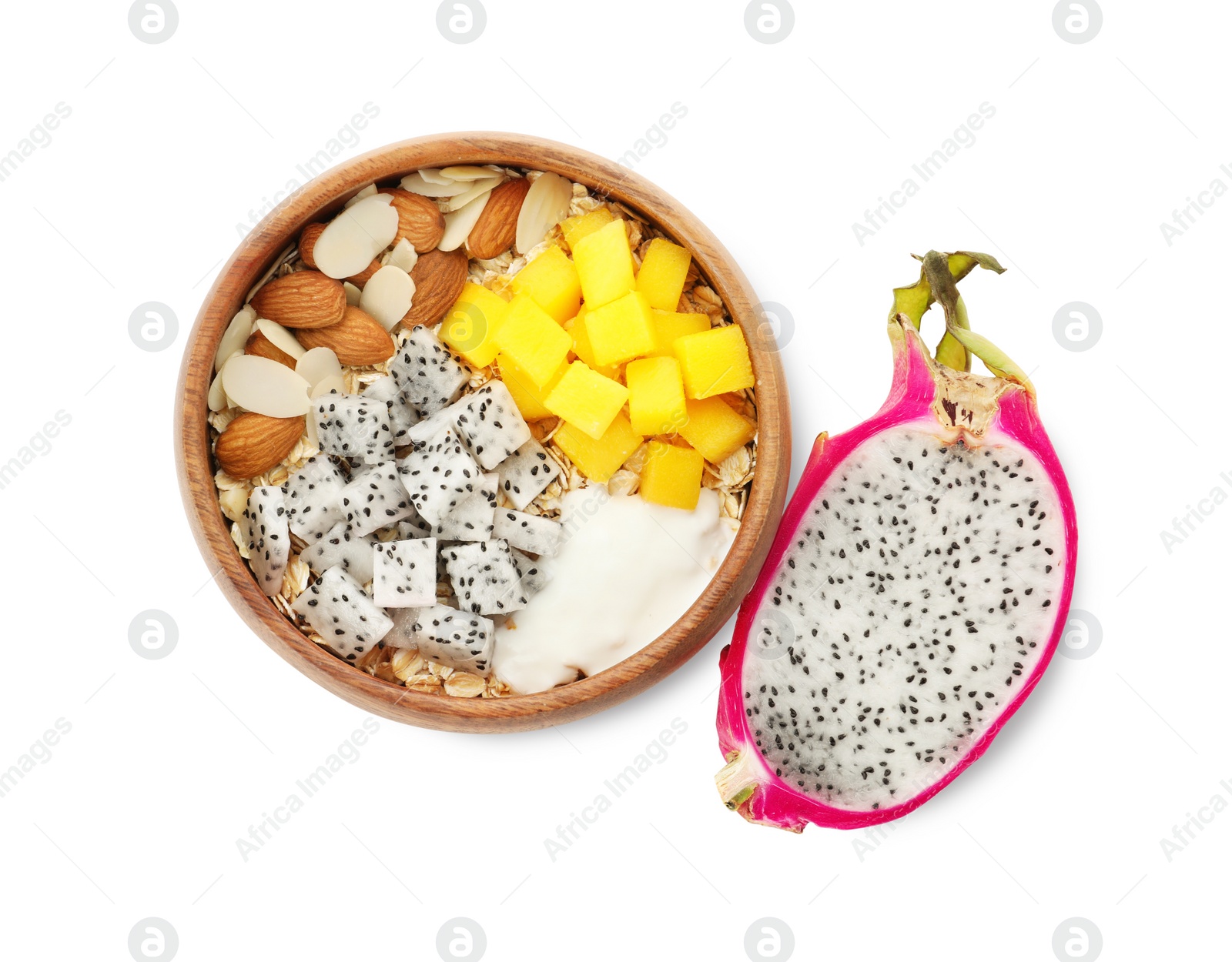 Photo of Bowl of granola with pitahaya, mango, almonds and yogurt on white background, top view