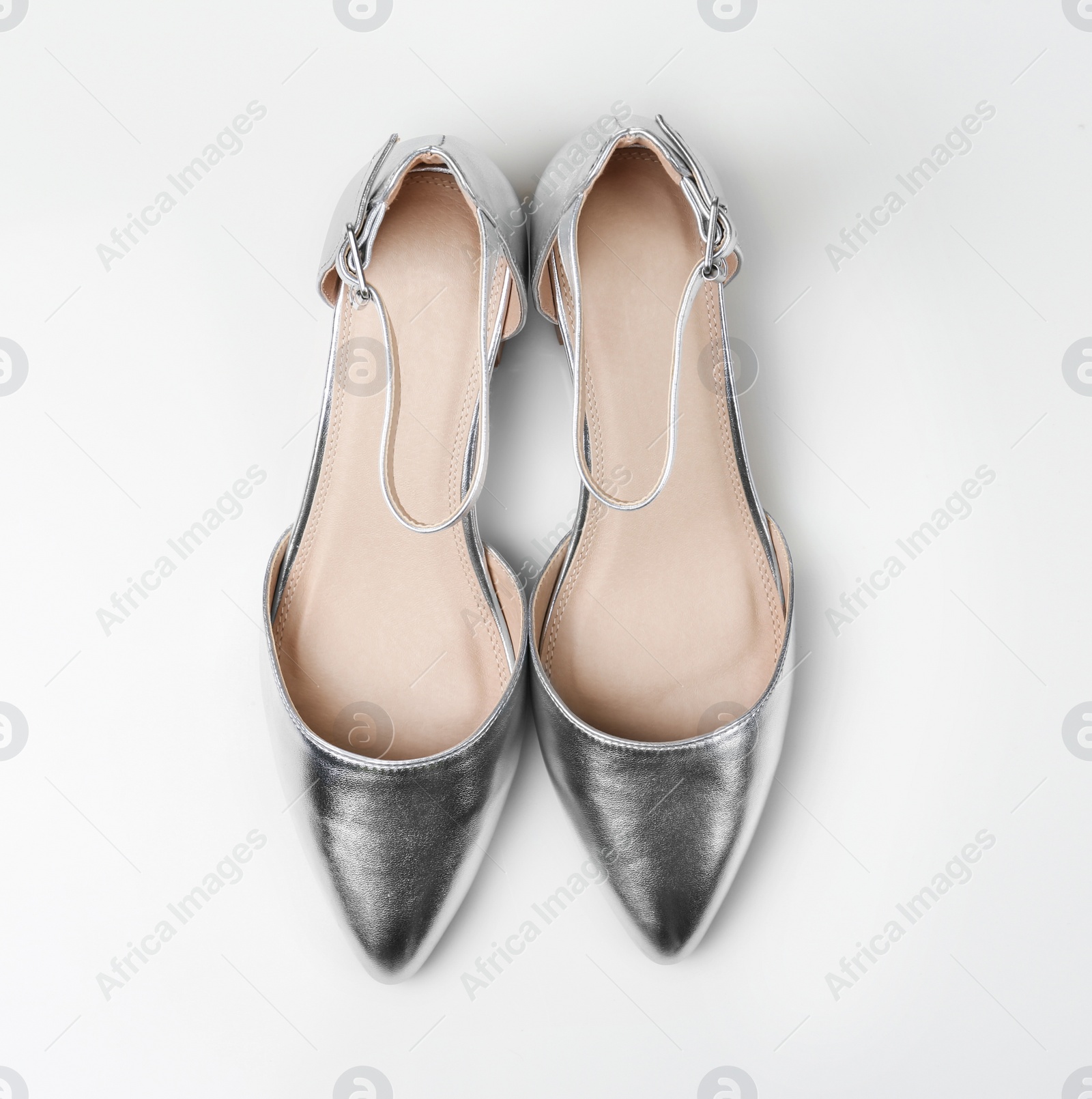 Photo of Pair of female shoes on white background, top view