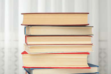 Collection of different hardcover books indoors, closeup