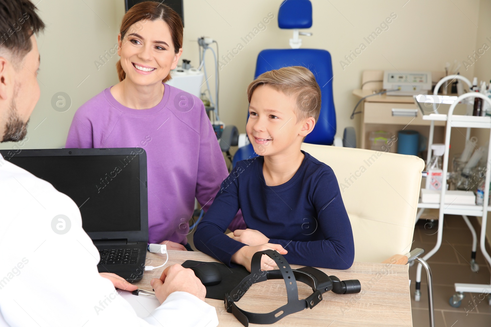 Photo of Woman with her child visiting doctor in hospital