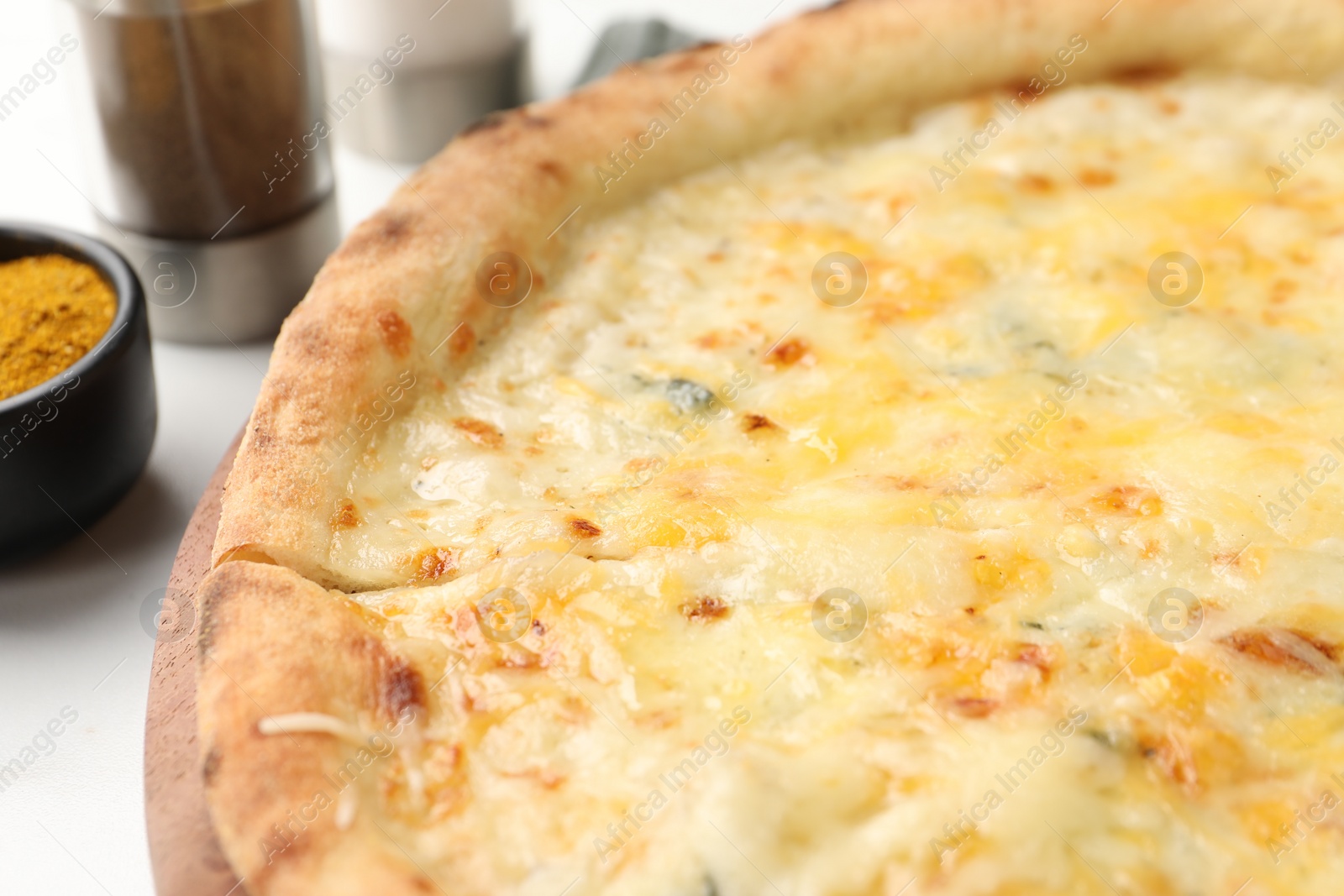 Photo of Delicious cheese pizza on white table, closeup